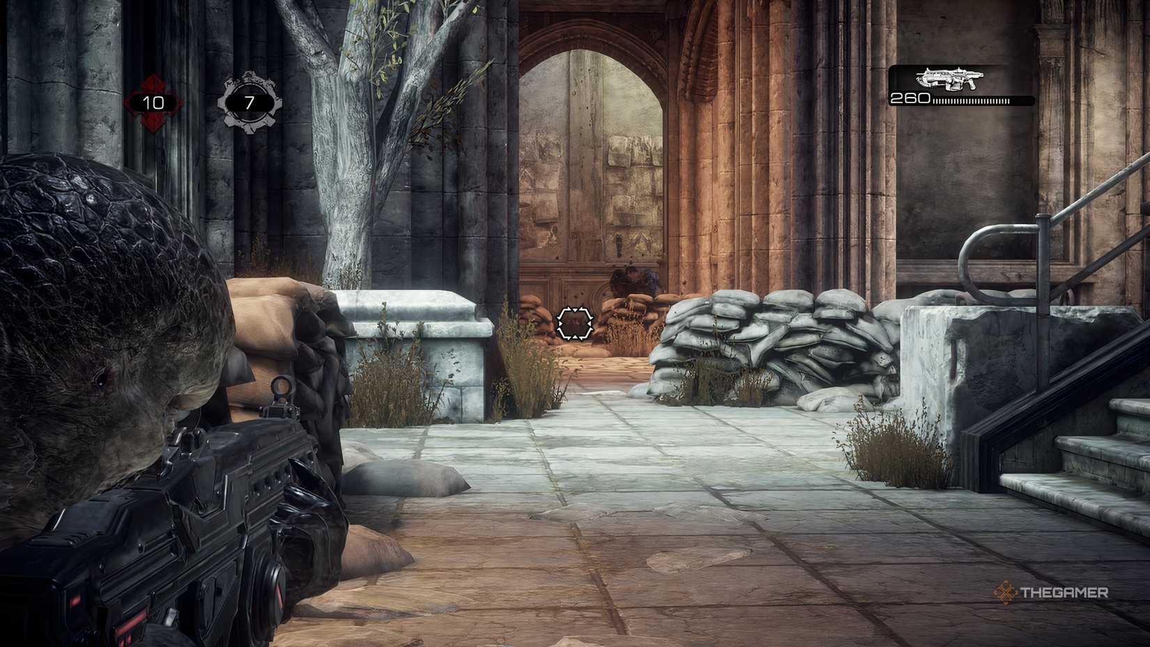 The player in Gears of War: Reloaded aiming down sights. They are targeting an enemy in the distance.