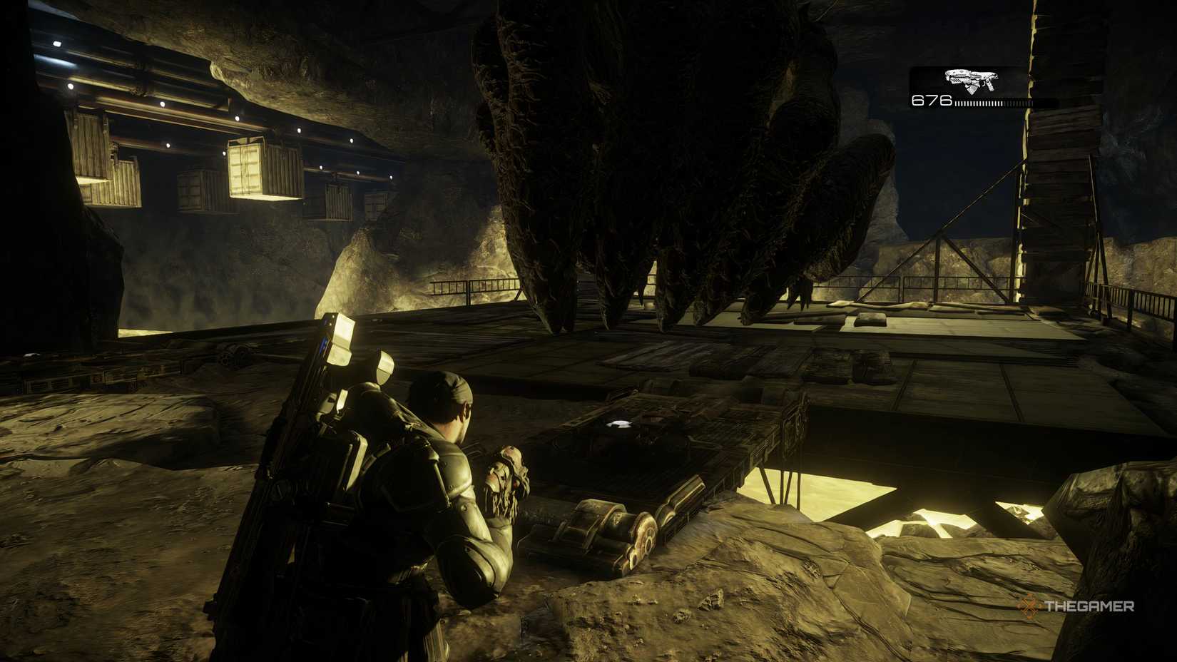The Corpser on a platform covering itself in Gears of War: Reloaded. The player is standing infront of the creature.