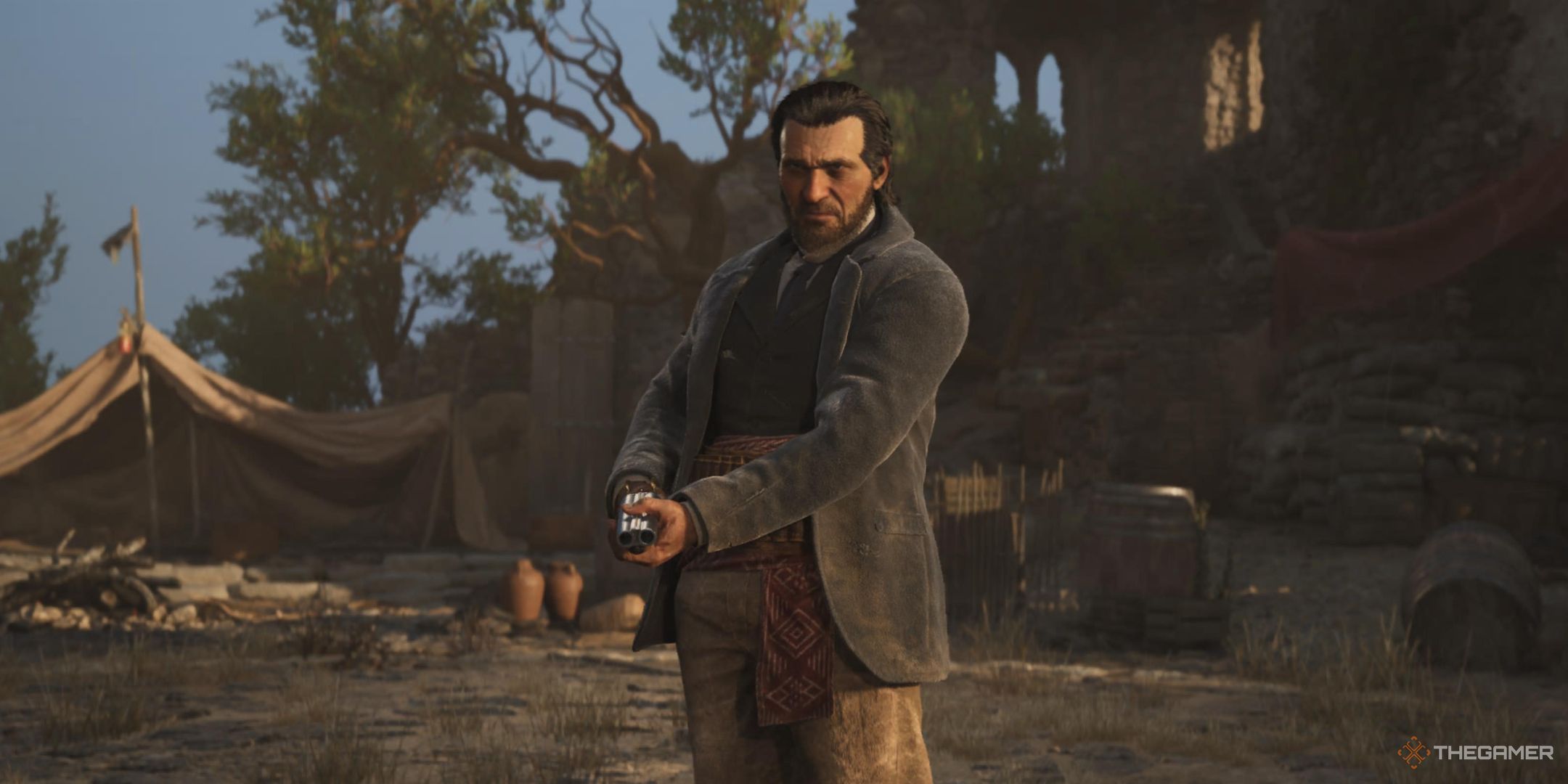 messina holds a shotgun at his camp in mafia: the old country.
