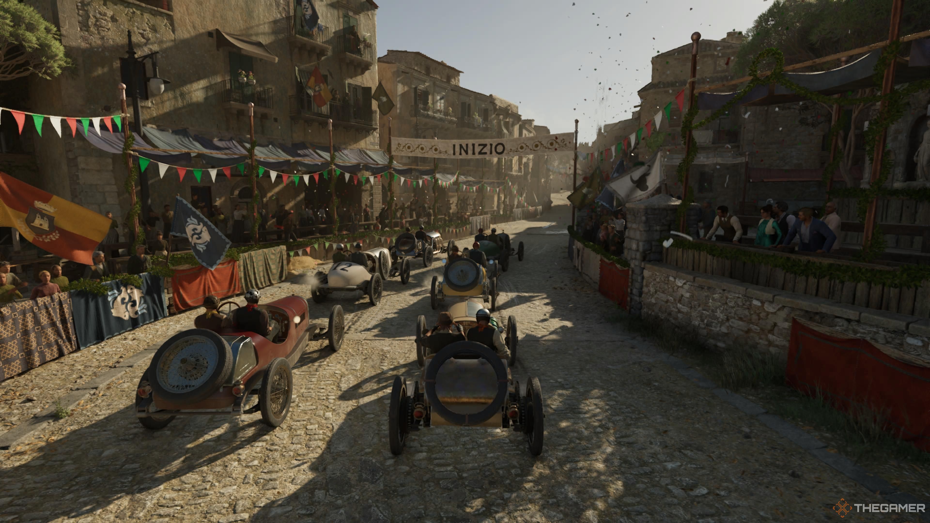 the cars line up at the start of the race in mafia: the old country.