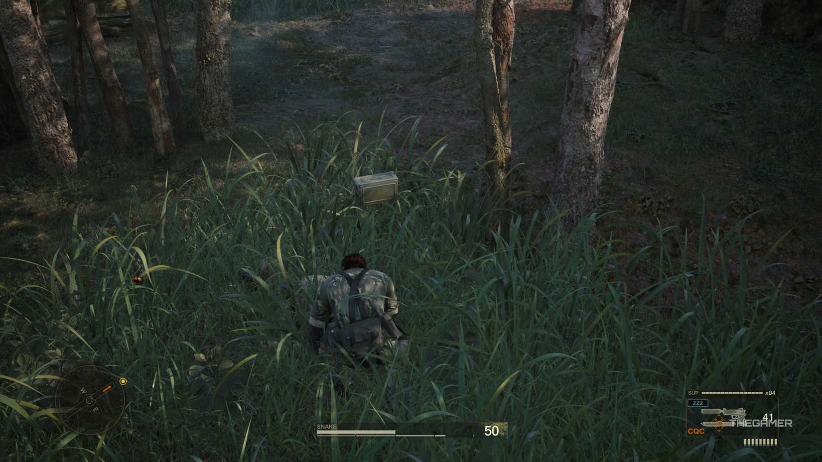 Naked Snake dragging an unconscious enemy into tall grass, shaking ammunition out of him in the process, in Metal Gear Solid Delta: Snake Eater.