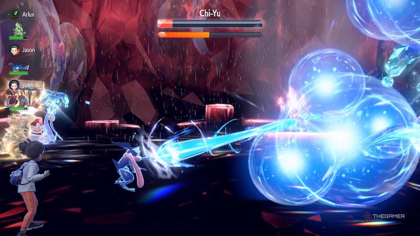 Greninja uses Hydro Pump on Shiny Chi-Yu during a Tera Raid battle in Pokemon Scarlet and Violet.