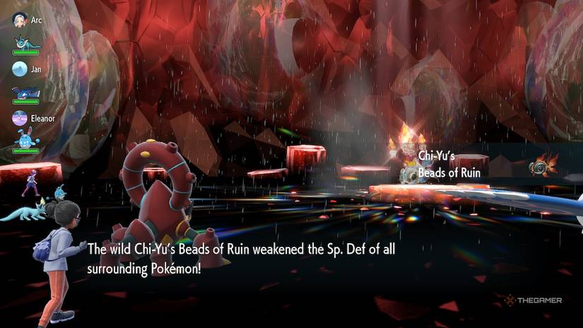 Shiny Chi-Yu uses its Beads of Ruin Ability on Volcanion during a Tera Raid battle in Pokemon Scarlet and Violet.