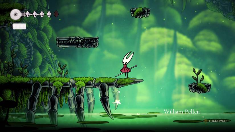 Hornet stands atop a hidden path in the Moss Grove in Hollow Knight: Silksong.