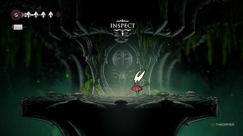 Hornet inspects the statue of Hera for the Silkspear Upgrade in Hollow Knight: Silksong.