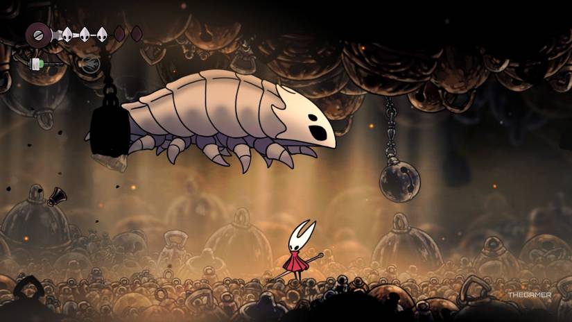 Bell Beast jumps over Hornet's head during their fight in Hollow Knight: Silksong.