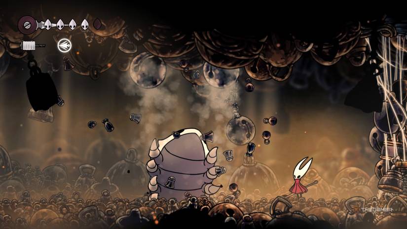 Bell Beast uses his Bell Burst attack and throws two bells in the air while fighting Hornet in Hollow Knight: Silksong.