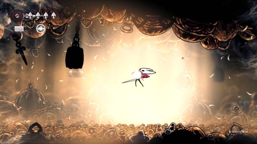 Hornet absorbs a Silk Heart after Bell Beast's defeat in Hollow Knight: Silksong.