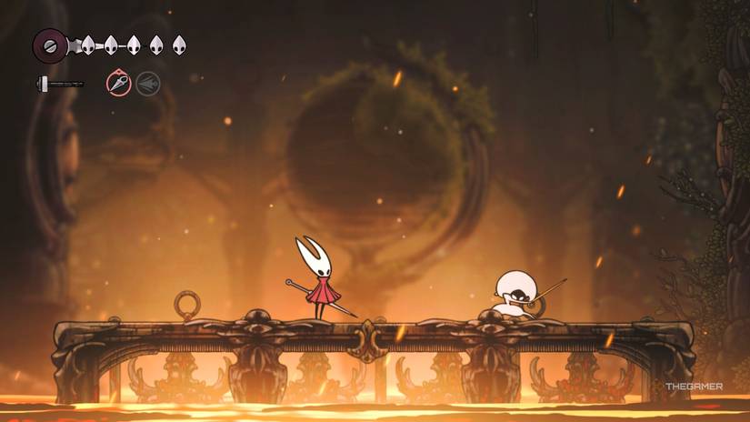 Lace prepares to strike Hornet during the Deep Docks fight in Hollow Knight: Silksong.
