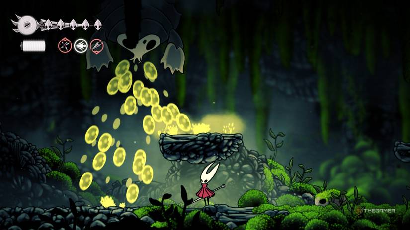 Hornet takes shelter under a platform from an acid spraying bug in the Mosslands in Hollow Knight: Silksong.