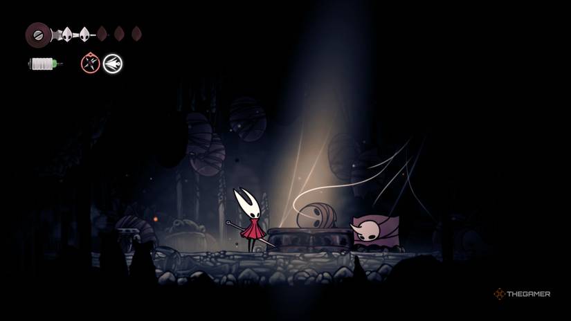 Hornet watches as pilgrims come to life to guard a Memory Locket in Hollow Knight: Silksong.