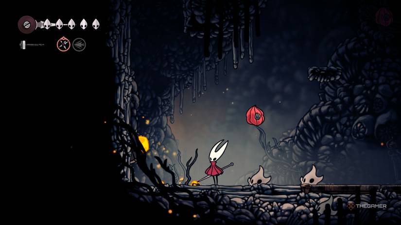 Hornet finds the second flintbeetle hiding in the wall to her left in Hollow Knight: Silksong.