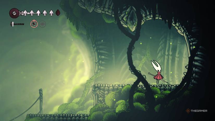 Hornet opens the locked doors to the west side of the Mosslands in Hollow Knight: Silksong.