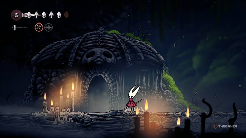 Hornet stands in front of the Chapel of the Wanderer in Hollow Knight: Silksong.
