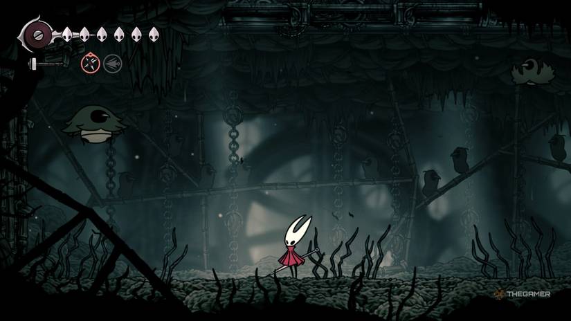Hornet stands in the Craw House, swarmed by crawbugs on either side in Hollow Knight: Silksong.