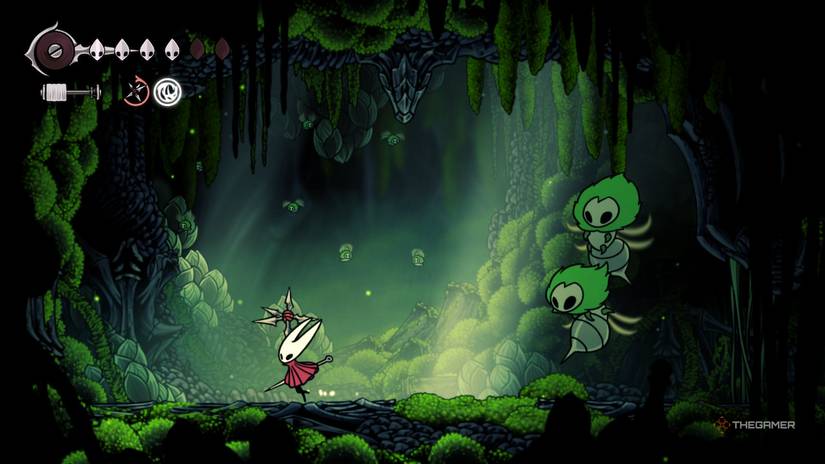 Hornet runs away from the Moss Mother Duo boss in Hollow Knight: Silksong.
