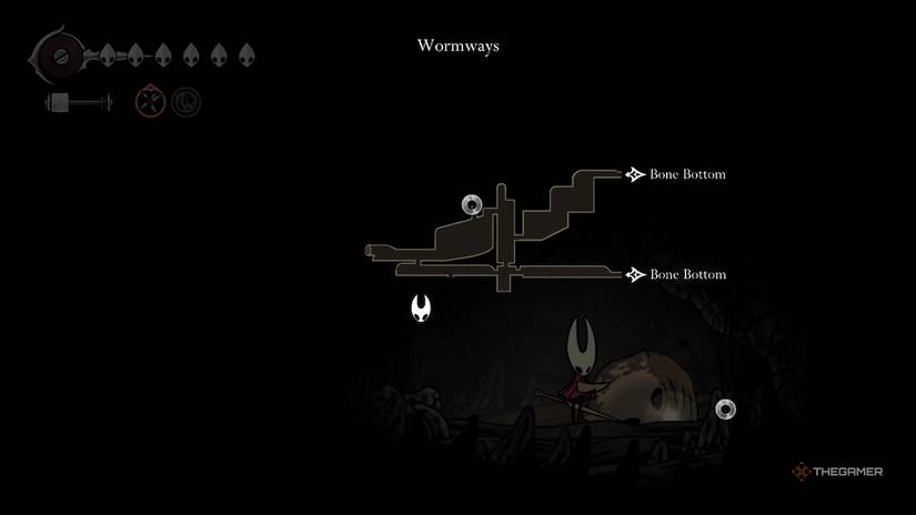 Hornet looks at her map in front of a Memory Locket in the Wormways in Hollow Knight: Silksong.