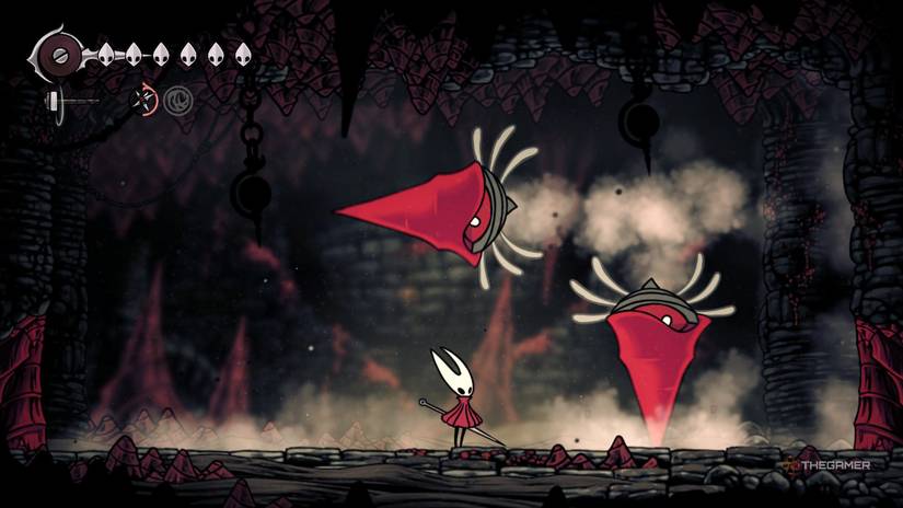 The Great Conchflies drill into walls on either side of Hornet in Hollow Knight: Silksong.