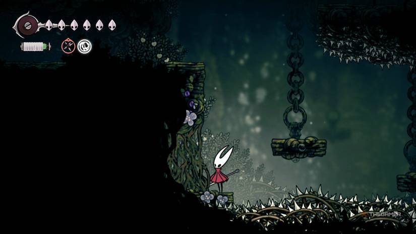 Hornet finds a vine wall blocking the final pollip heart in Hollow Knight: Silksong.