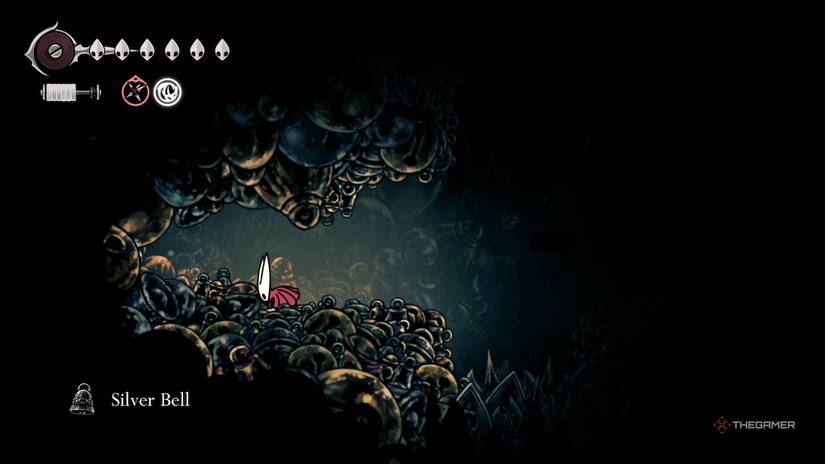 Hornet finds a Silver Bell in Hollow Knight: Silksong.
