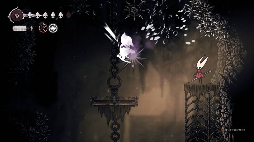 Hornet throws a poison trap at a flying enemy in Hollow Knight: Silksong.
