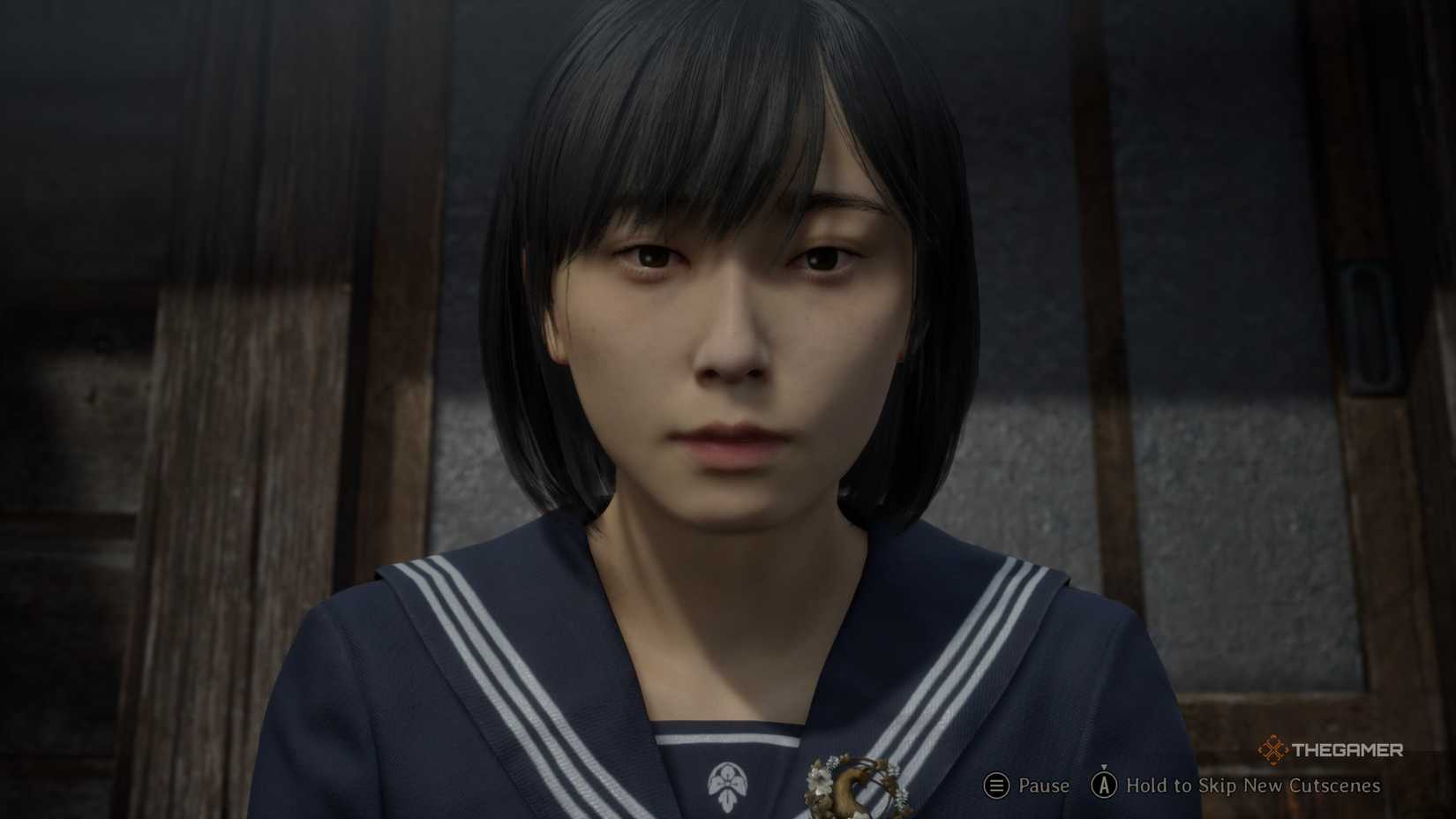 Hinako in the very beginning of silent hill f second playthrough wearing the inari emblem.