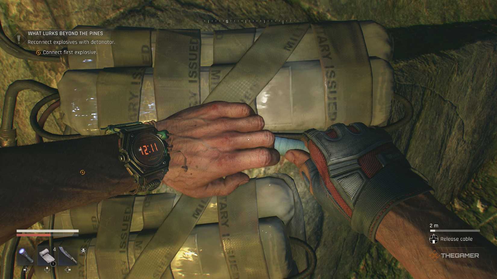 Connecting the cable to the explosive.
