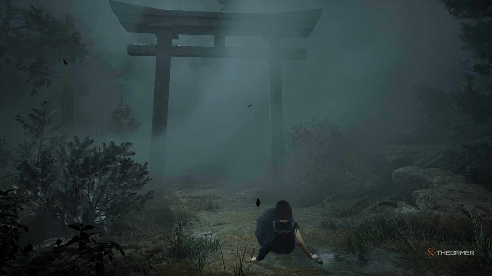 Himiko falls to her knees before a foggy shrine in Silent Hill f. 