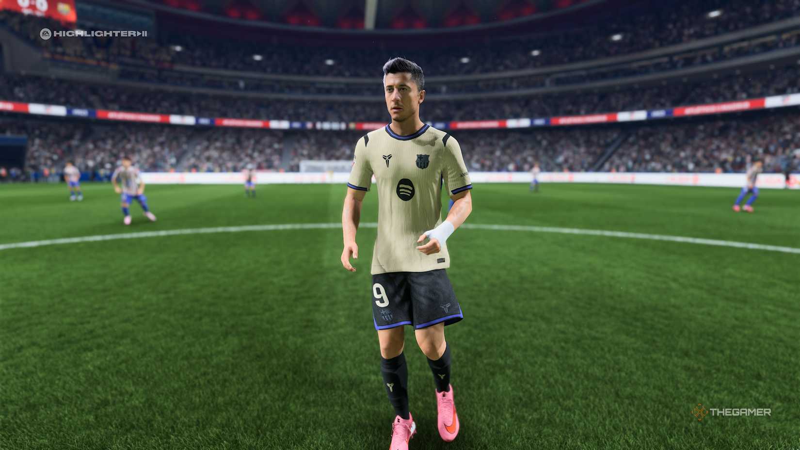 Robert Lewandowski stood near the middle of the pitch in EA Sports 26.