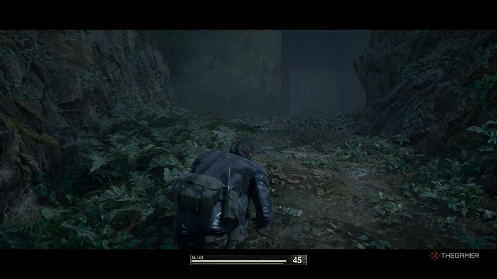 Snake Crouched down looking at entrance to warehouse in Metal Gear Solid: Delta Snake Eater.