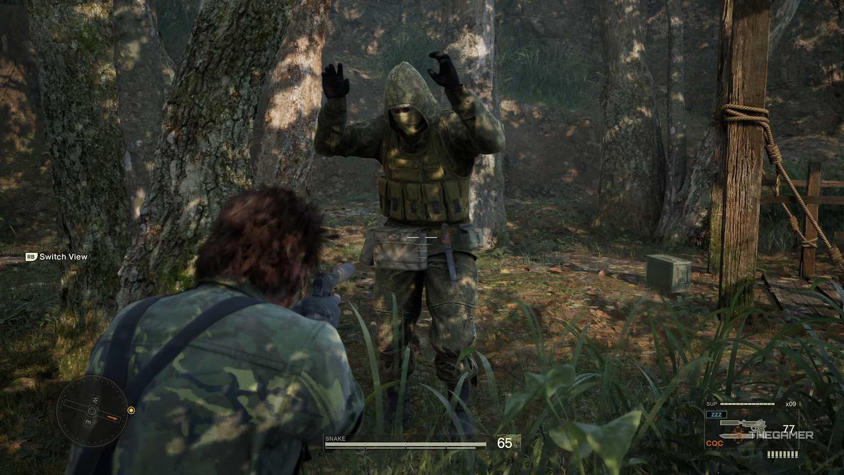 Snake pointing gun at guard with an item next to them in Metal Gear Solid Delta Snake Eater.