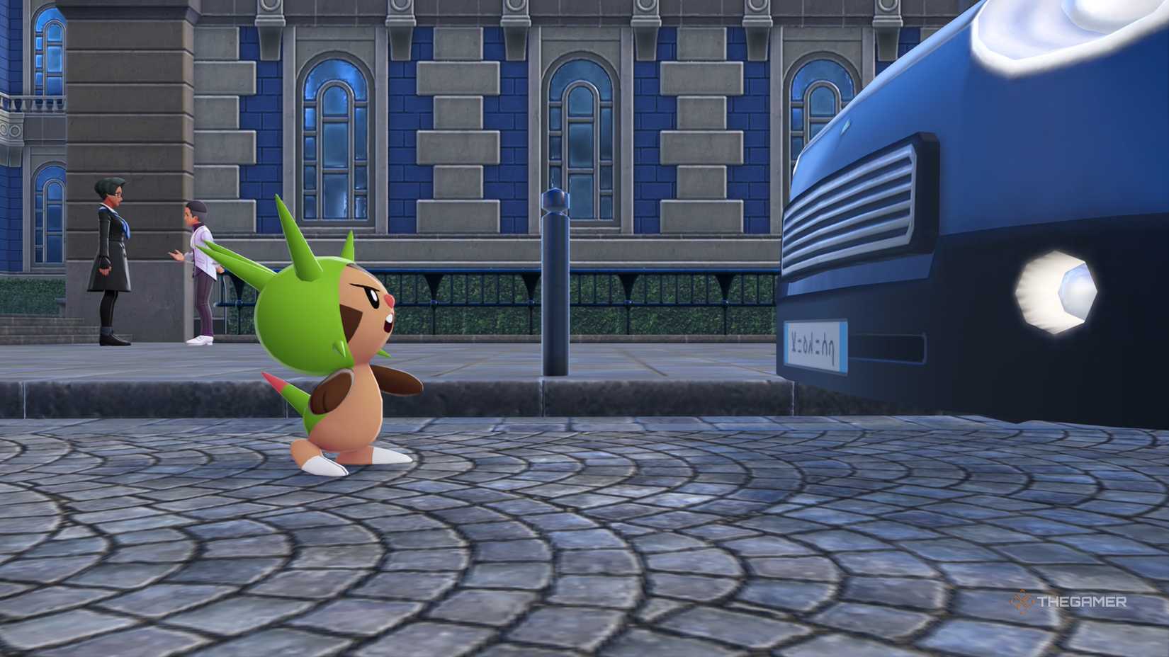 Chespin squares up and intimidates a blue taxi car in Pokemon Legends: Z-A.