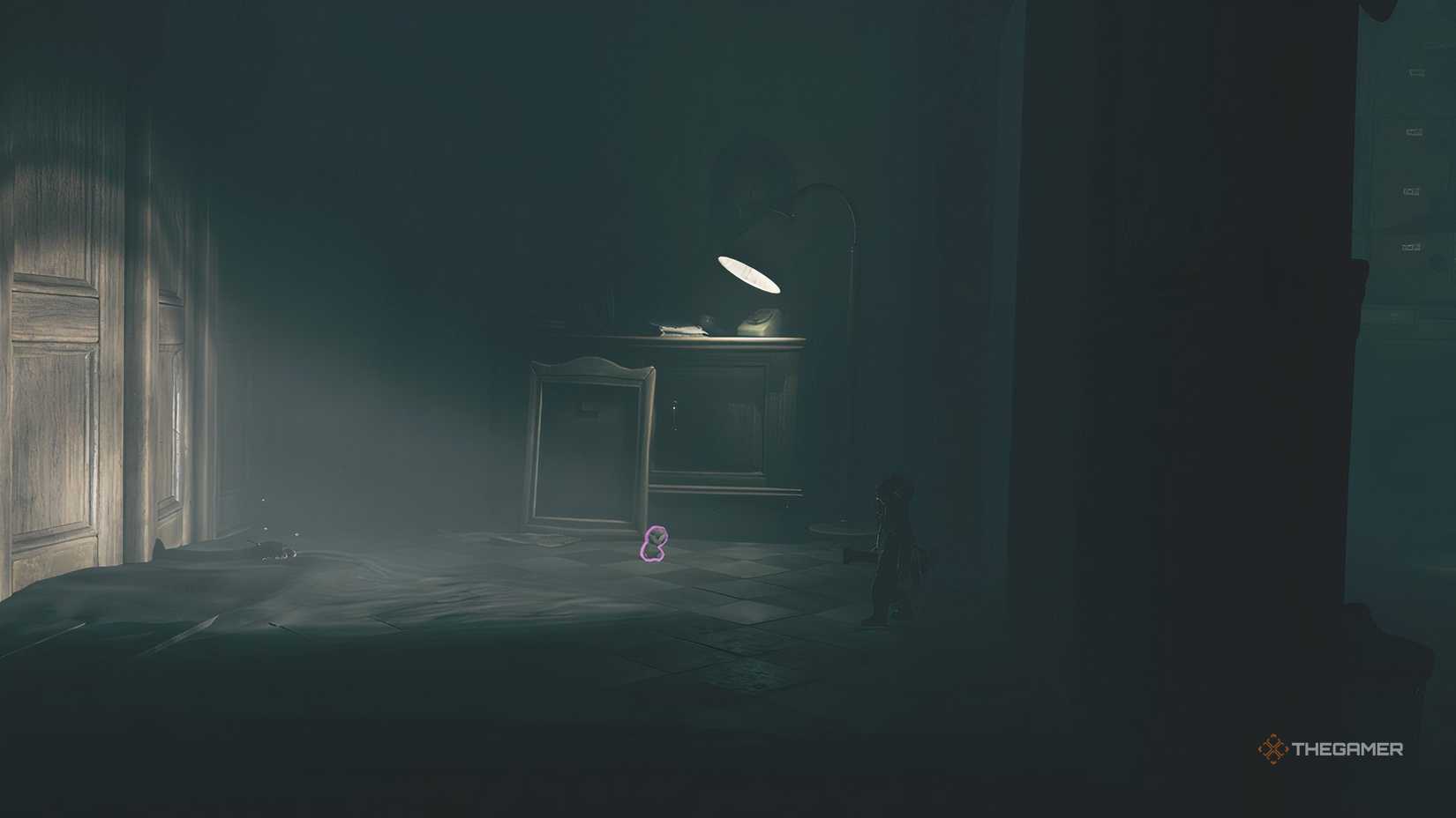 Alone collecting a doll in an office in Little Nightmares 3.
