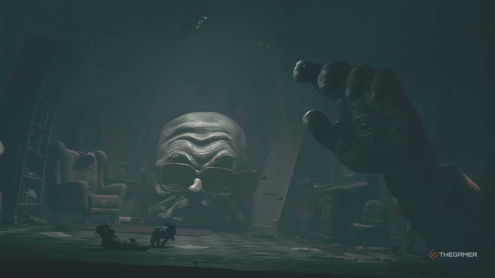 The boss of chapter 4 reaching down to grab Low and Alone in Little Nightmares 3.