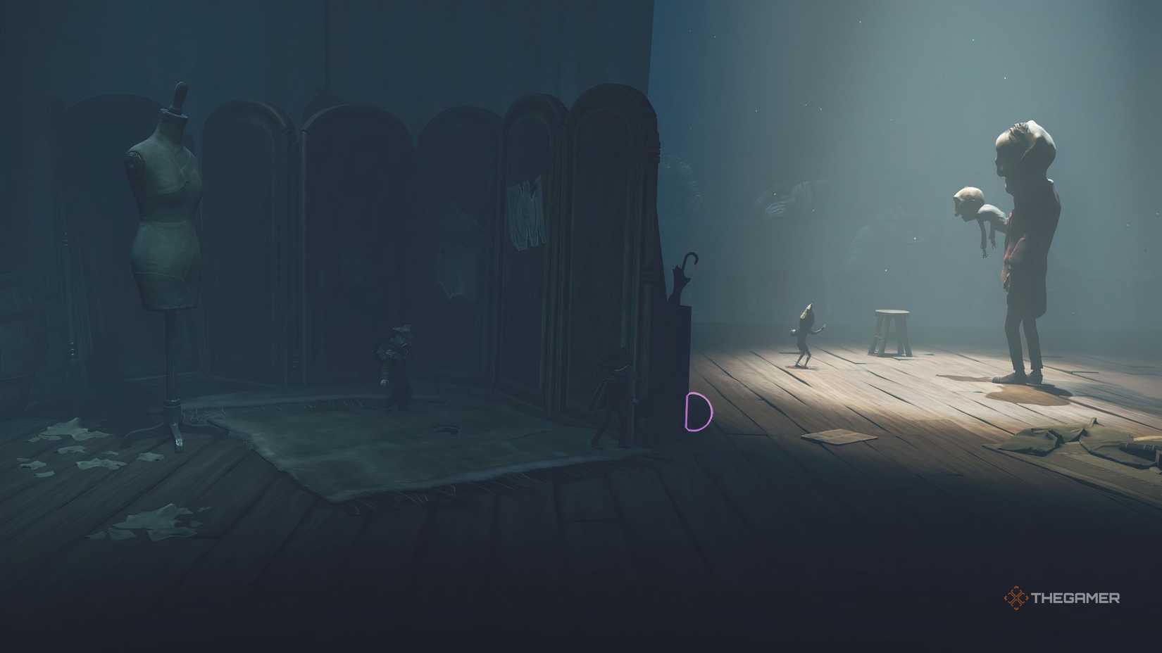 Alone and Low hiding on a stage in Little Nightmares 3.