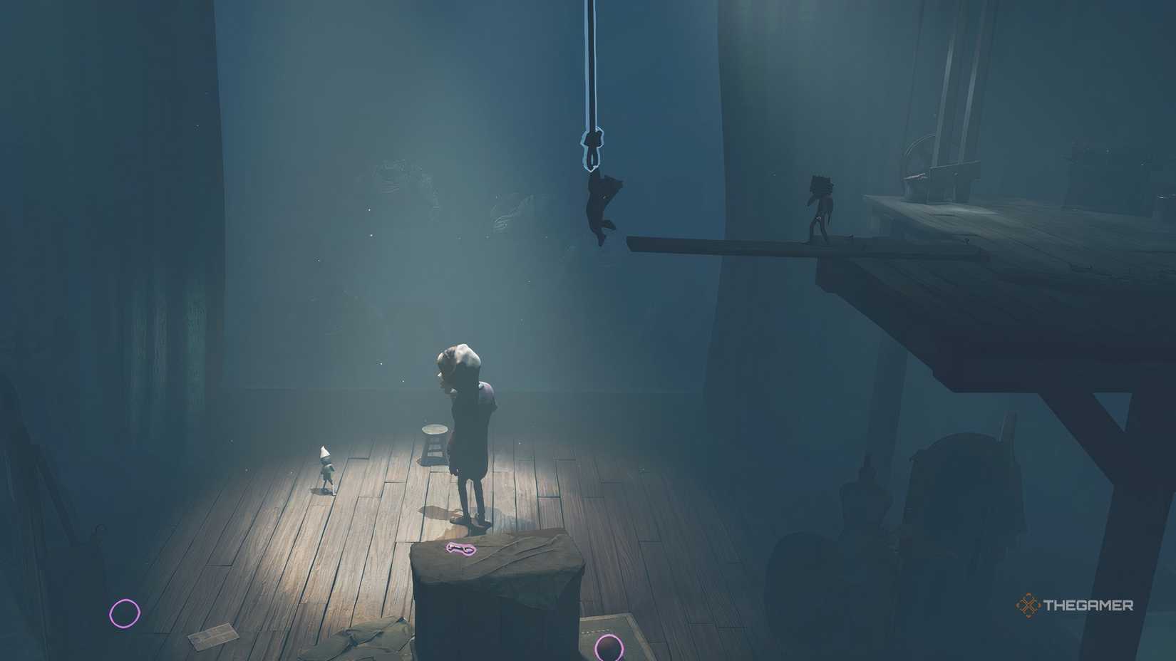 Alone lowering onto a crate with a key in Little Nightmares 3.