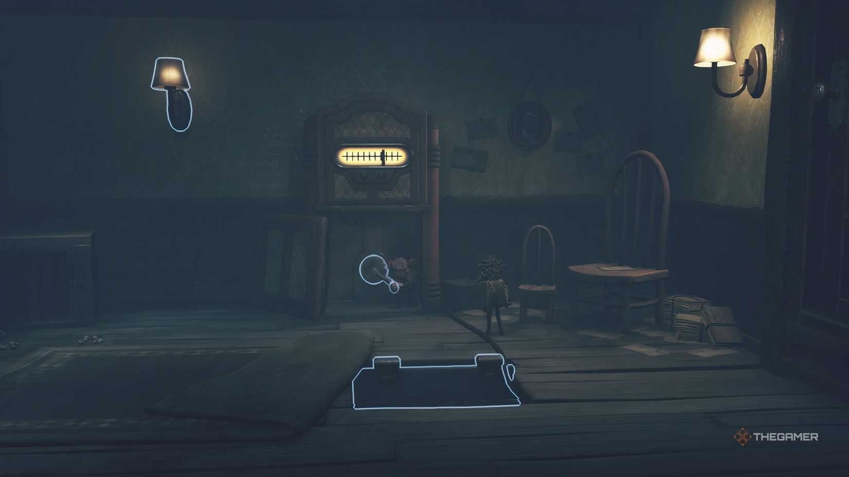 Alone spinning a crank on a radio in Little Nightmares 3.