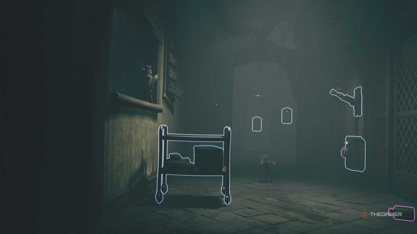 Alone using a cart to reach a window in Little Nightmares 3.