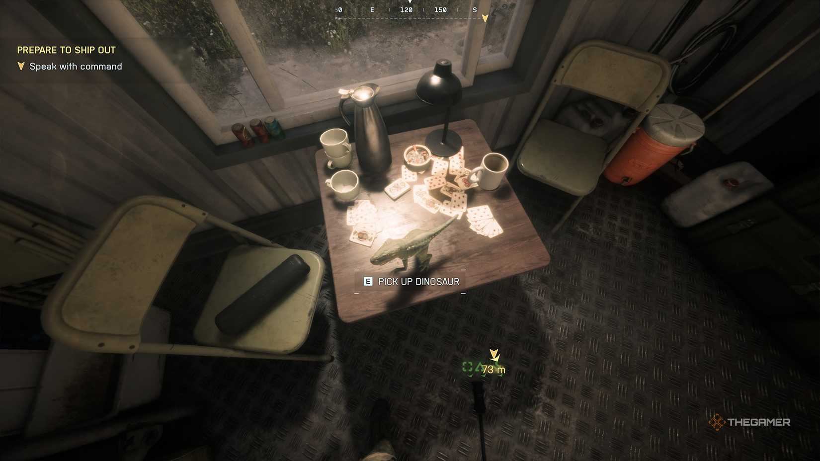 Battlefield 6 player looking at a toy dinosaur on a table next to scattered playing cards and empty coffee mugs.