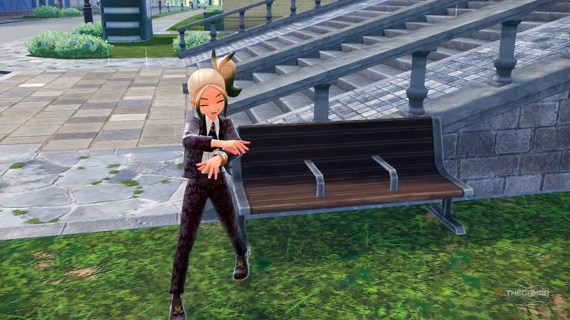 The MC stands next to a Bench in Pokemon Legends Z-A.