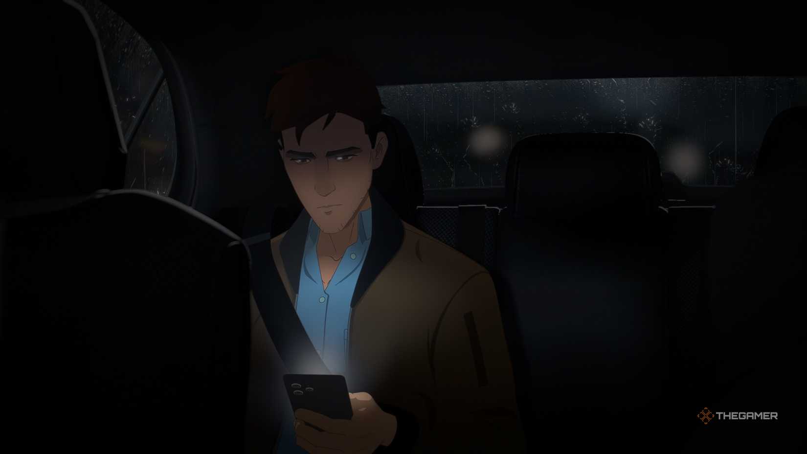 Dispatch Robert texting in the back seat of a car.