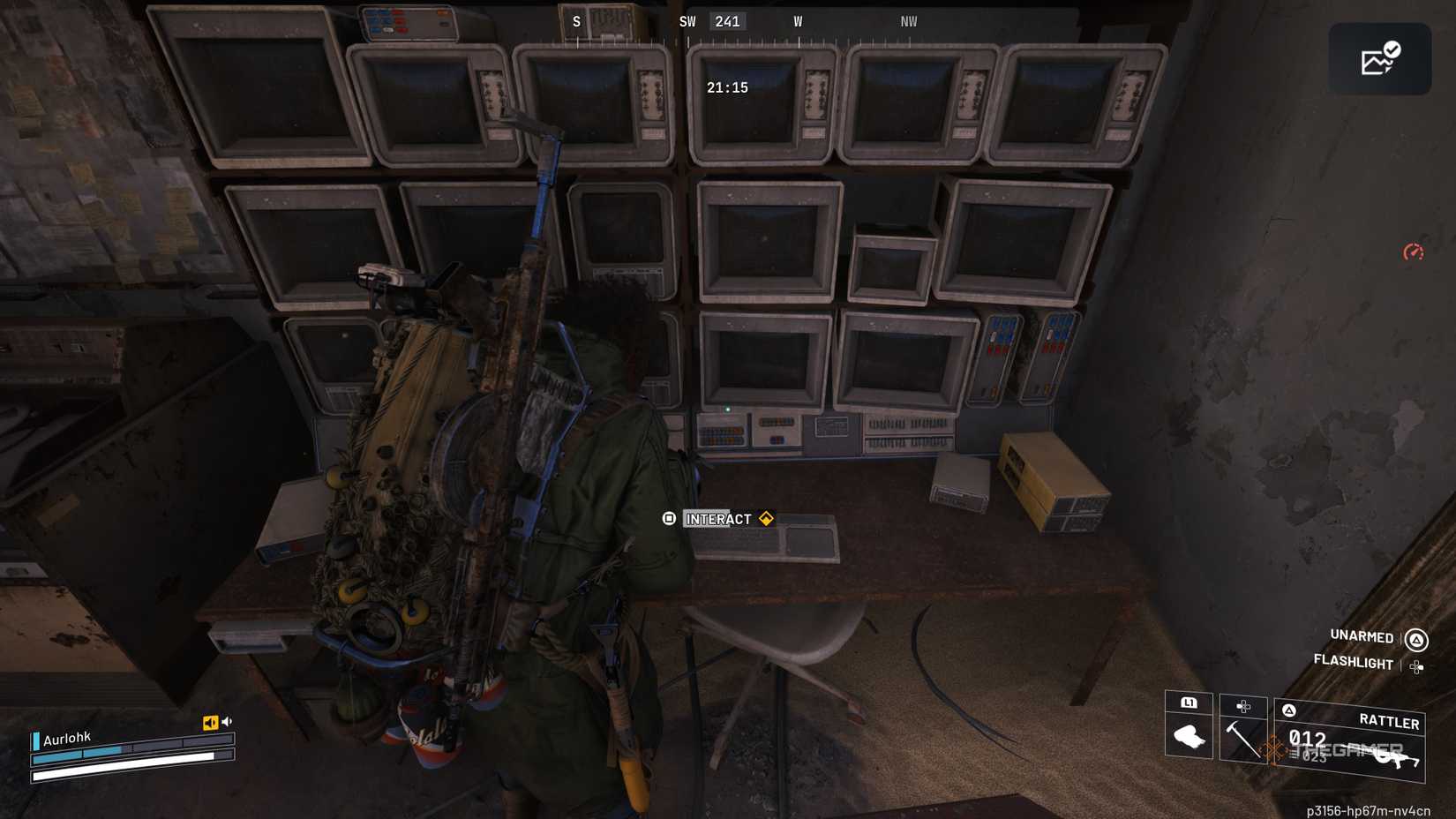 Player raider interacting and using a keyboard on a desk surrounded by monitors in Arc Raiders.