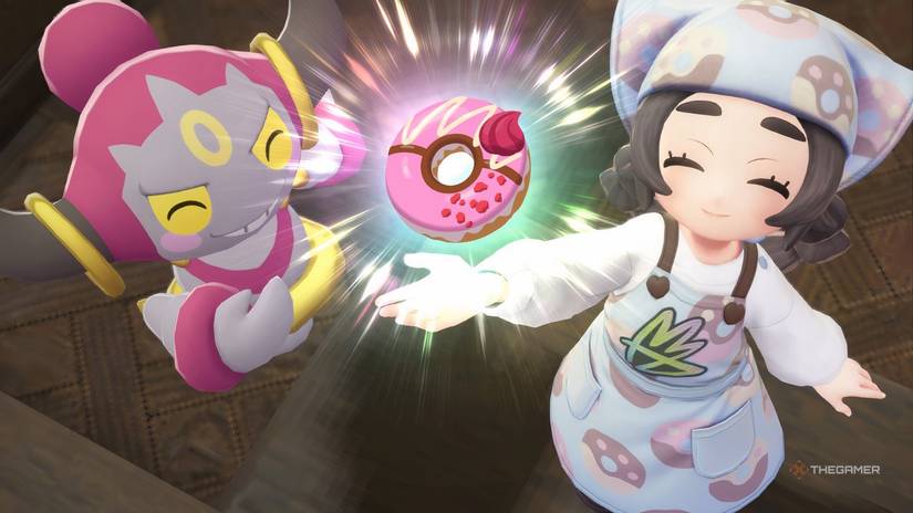Ansha and Hoopa holding up a Donut in Pokemon Legends: z-A.