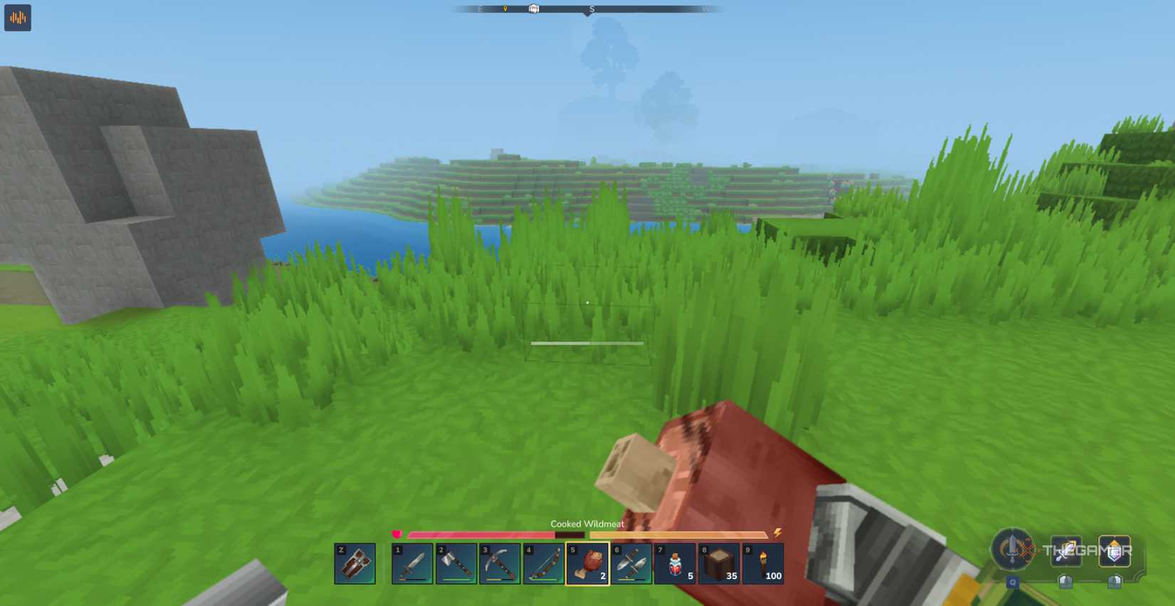 Player character eating a piece of Cooked Wildmeat from their hotbar while traveling in Hytale.