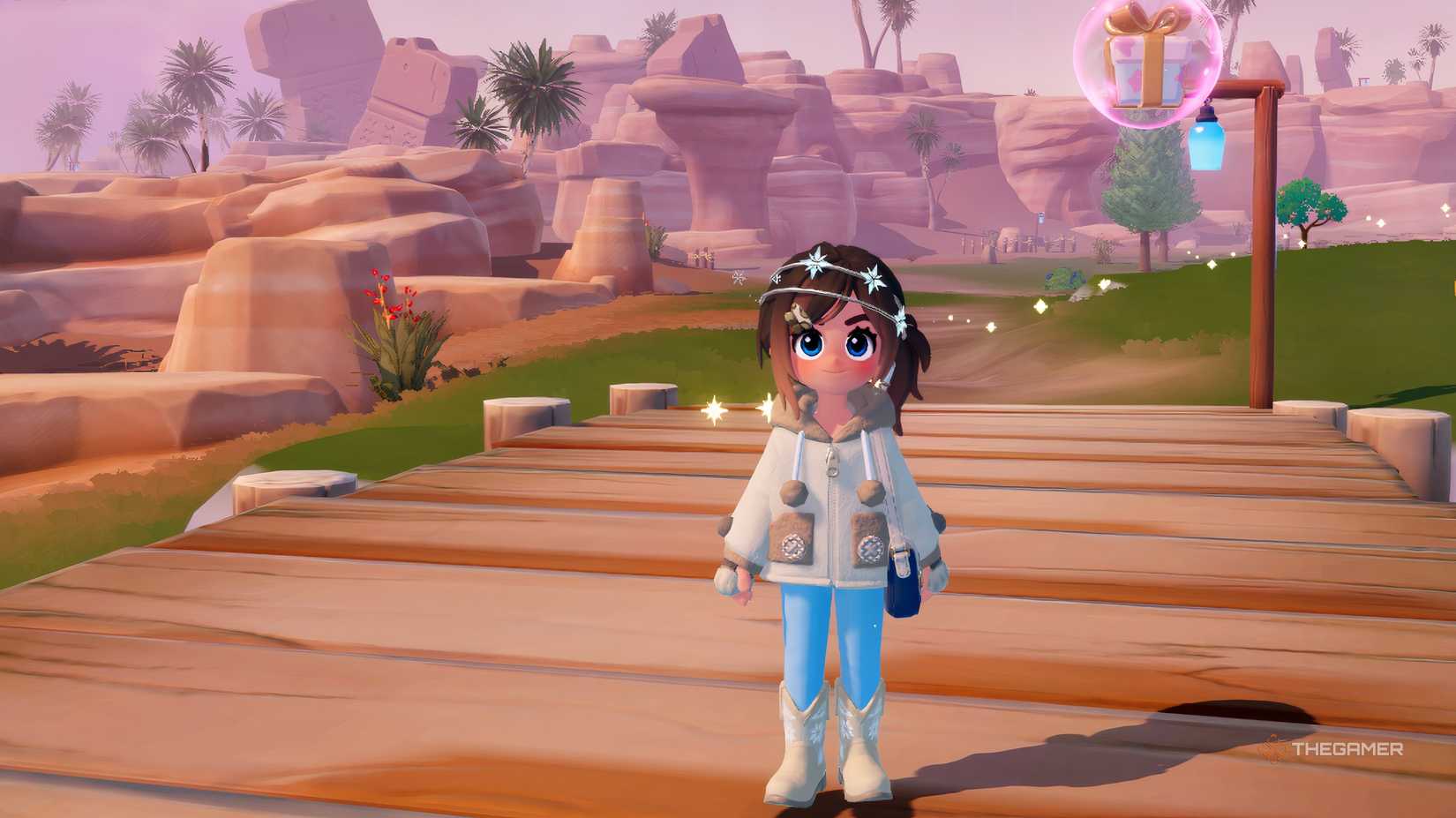 Розовый пузырь с подарком в Хартопии и персонаж в зимней одежде.